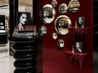Red store wall with round mirrors