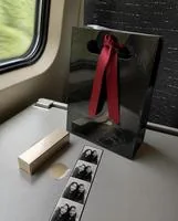 Gift bag and photo strip on a train table