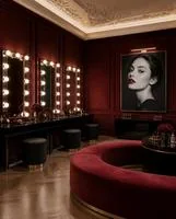 Velvet lounge with bulb-lit mirrors
